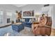 Comfortable living room boasts a blue sofa, leather chair, coastal decor, and a cozy ambiance at 308 44Th Ave. N, North Myrtle Beach, SC 29582