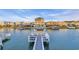 Pier with seating offers stunning views of the waterway and surrounding waterfront homes at 308 44Th Ave. N, North Myrtle Beach, SC 29582