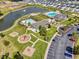 Aerial view of a community with pools, clubhouses, ponds, playgrounds, and green spaces at 3212 Saddlewood Circle, Myrtle Beach, SC 29579