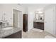 Well lit bathroom featuring a granite countertop and tile flooring, creating a clean space at 3212 Saddlewood Circle, Myrtle Beach, SC 29579