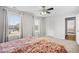 Bedroom with natural lighting from two windows with light-filtering shades, doorway and ceiling fan at 3212 Saddlewood Circle, Myrtle Beach, SC 29579