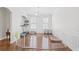 Bright dining room with hardwood floors, white walls, and a modern chandelier, perfect for entertaining at 3212 Saddlewood Circle, Myrtle Beach, SC 29579
