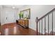 Elegant foyer featuring hardwood floors, a decorative mirror, and an open view to the front door at 3212 Saddlewood Circle, Myrtle Beach, SC 29579