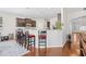 Kitchen bar with seating, dark cabinets, granite counters; open design for easy living and entertaining at 3212 Saddlewood Circle, Myrtle Beach, SC 29579