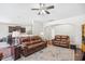 Spacious living room with an open floor plan, ceiling fan, and views into the dining area at 3212 Saddlewood Circle, Myrtle Beach, SC 29579