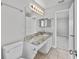 Well-lit bathroom featuring a marble countertop vanity and a view into the adjacent room at 3563 Chestnut Dr. # 3563, Myrtle Beach, SC 29577