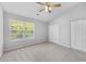 Bedroom featuring a large window with natural light, ceiling fan, and closet at 3563 Chestnut Dr. # 3563, Myrtle Beach, SC 29577