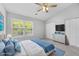Bright bedroom with a ceiling fan, window with view, and ample closet space at 3563 Chestnut Dr. # 3563, Myrtle Beach, SC 29577
