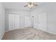 Bedroom showcasing a ceiling fan, neutral walls, and closet storage at 3563 Chestnut Dr. # 3563, Myrtle Beach, SC 29577