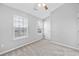 Bedroom features neutral paint, plush carpet, a ceiling fan and two windows at 3563 Chestnut Dr. # 3563, Myrtle Beach, SC 29577