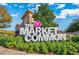 The Market Common entrance sign with colorful foliage and clear blue skies, inviting you to explore at 3563 Chestnut Dr. # 3563, Myrtle Beach, SC 29577