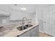 Bright kitchen with stainless steel sink, granite counters, and white cabinets at 3563 Chestnut Dr. # 3563, Myrtle Beach, SC 29577