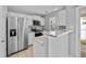 Modern kitchen with stainless steel appliances, granite counters, and tile floor at 3563 Chestnut Dr. # 3563, Myrtle Beach, SC 29577