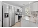 All white kitchen with stainless steel appliances and granite countertops at 3563 Chestnut Dr. # 3563, Myrtle Beach, SC 29577