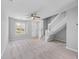 Cozy living room with staircase, window and neutral walls and carpet at 3563 Chestnut Dr. # 3563, Myrtle Beach, SC 29577
