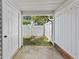 Enclosed patio area featuring a door to the yard and a peek into the yard at 3563 Chestnut Dr. # 3563, Myrtle Beach, SC 29577
