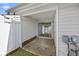 Covered patio featuring white picket fence and slider to the home interior at 3563 Chestnut Dr. # 3563, Myrtle Beach, SC 29577