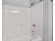 Clean, bright white shower and tub combination with chrome fixtures and white tile surround at 3563 Chestnut Dr. # 3563, Myrtle Beach, SC 29577