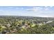 Expansive aerial view of the home showcasing a lush, green neighborhood near the ocean at 3731 Spruce Dr., Myrtle Beach, SC 29577