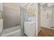 Bathroom with shower-tub, vanity with sink, and neutral wall tile at 3731 Spruce Dr., Myrtle Beach, SC 29577