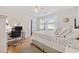 Bright bedroom with hardwood floors, a cozy quilt, and dedicated desk space at 3731 Spruce Dr., Myrtle Beach, SC 29577