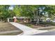 Inviting single-story brick home featuring a long driveway and mature shade tree at 3731 Spruce Dr., Myrtle Beach, SC 29577