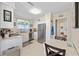Well-lit kitchen with stainless steel appliances, white cabinets, and a cozy dining table at 3731 Spruce Dr., Myrtle Beach, SC 29577