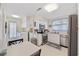 Cozy kitchen featuring stainless appliances, white cabinetry, and eat-in breakfast table at 3731 Spruce Dr., Myrtle Beach, SC 29577