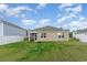 A large backyard is fully fenced and features a screened in porch, great for outdoor living at 376 Black Pearl Way, Myrtle Beach, SC 29588