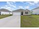 Single-story home with a two-car garage, manicured lawn, and inviting curb appeal at 376 Black Pearl Way, Myrtle Beach, SC 29588