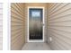 Charming front entry door detailed with sidelight and modern hardware, creating curb appeal at 376 Black Pearl Way, Myrtle Beach, SC 29588