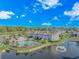 Aerial view of community showing a lake, pool, clubhouse, landscaping, and multi-Gathering buildings at 3795 Hitchcock Way # 617, Myrtle Beach, SC 29577