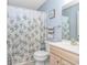 Cozy bathroom featuring a toilet and vanity with a white and green leaf print shower curtain at 3795 Hitchcock Way # 617, Myrtle Beach, SC 29577