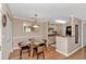 Bright dining area with a round glass table and access to the kitchen at 3795 Hitchcock Way # 617, Myrtle Beach, SC 29577