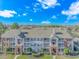 Beautiful condo building with gray siding, brick accents, and well-maintained landscaping at 3795 Hitchcock Way # 617, Myrtle Beach, SC 29577