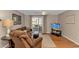 Cozy living room with wood floors, comfortable seating, and natural light from the sliding glass doors at 3795 Hitchcock Way # 617, Myrtle Beach, SC 29577