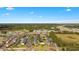 Aerial view of a meticulously landscaped community with a serene lake and well-maintained buildings, offering a peaceful environment at 3943 Gladiola Ct. # 202, Myrtle Beach, SC 29588