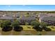 Aerial view of community with well-manicured lawns and pond, providing a scenic and serene residential experience at 3943 Gladiola Ct. # 202, Myrtle Beach, SC 29588