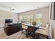 Cozy living room with table and seating area near large bright windows at 3943 Gladiola Ct. # 202, Myrtle Beach, SC 29588