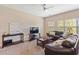 Comfortable living room features plush leather seating and natural light from large bright windows at 3943 Gladiola Ct. # 202, Myrtle Beach, SC 29588
