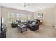 Spacious living room featuring carpet, a ceiling fan and lots of natural light at 3943 Gladiola Ct. # 202, Myrtle Beach, SC 29588