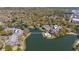 Lush aerial view of a community surrounding a lake with a pool and landscaping at 410 Melrose Pl. # 110, Myrtle Beach, SC 29572