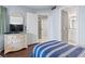 Guest bedroom with TV, adjacent to hall and bathroom at 410 Melrose Pl. # 110, Myrtle Beach, SC 29572