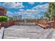 Pool deck area with wood planks, featuring a wooden fence surrounding the pool area and bicycle racks at 410 Melrose Pl. # 110, Myrtle Beach, SC 29572