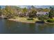 Scenic water view of the lake featuring ducks and trees with homes in the background at 410 Melrose Pl. # 110, Myrtle Beach, SC 29572