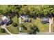 Stunning aerial view of a home showcasing its sprawling lawn, mature trees, and neighborhood at 4100 Hagwood Circle, Conway, SC 29526