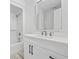 Bright bathroom features a white vanity with quartz countertop, tub-shower combo, and modern finishes at 4100 Hagwood Circle, Conway, SC 29526