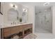 Bright bathroom features a double sink vanity with a large glass shower with marble tile at 4100 Hagwood Circle, Conway, SC 29526