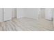 Spacious and clean bedroom showing the light, modern wood-look flooring and bright white doors and trim at 4100 Hagwood Circle, Conway, SC 29526