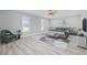 Large bedroom with ceiling fan, picture windows, stylish furniture, and modern decor at 4100 Hagwood Circle, Conway, SC 29526